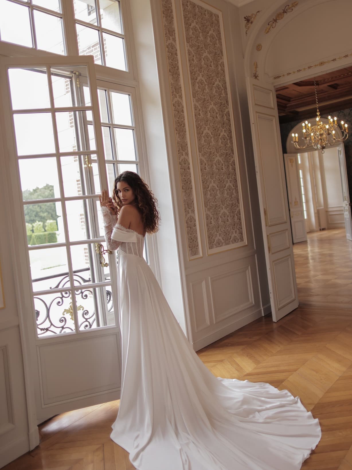 Murray - Wona wedding dress by Wona Concept Flowing off-the-shoulder gown with corseted bodice and delic... view 2
