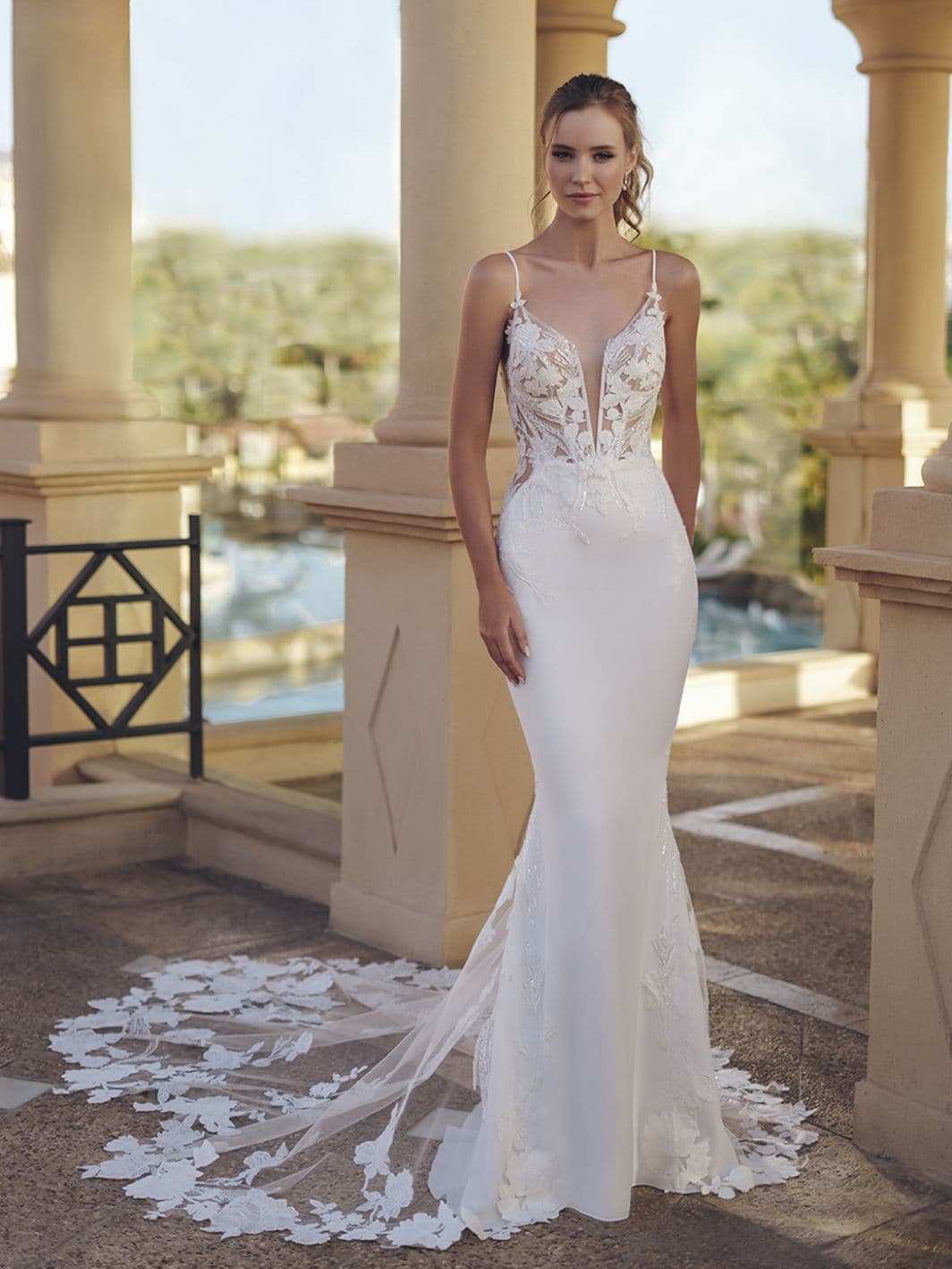 Front view of Blue by Enzoani Samantha wedding dress with lace bodice, plunging neckline, and fitted crepe skirt