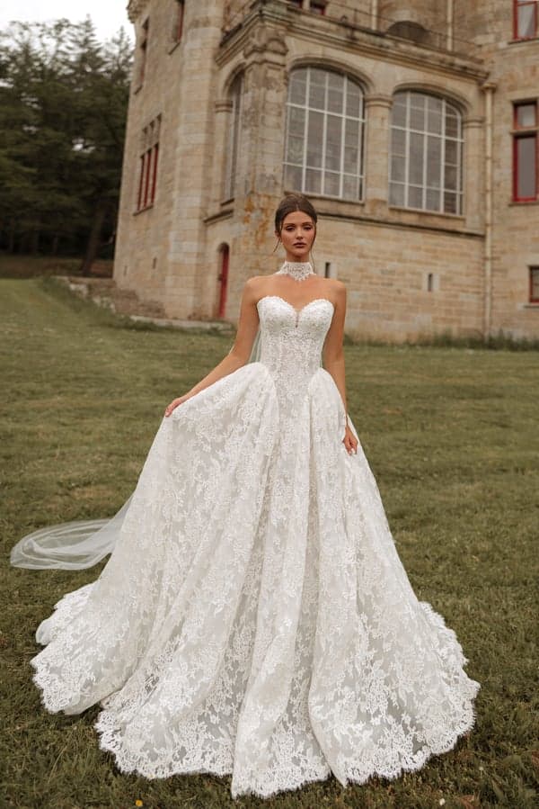 Avel - Katy Corso wedding dress by Katy Corso The Avel ball gown is made of Chantilly lace with floral pat... view 1