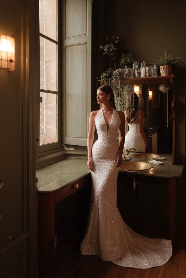 Bona - Katy Corso wedding dress by Katy Corso The Bona dress captures the eye with a plunging halter neckl... view 1