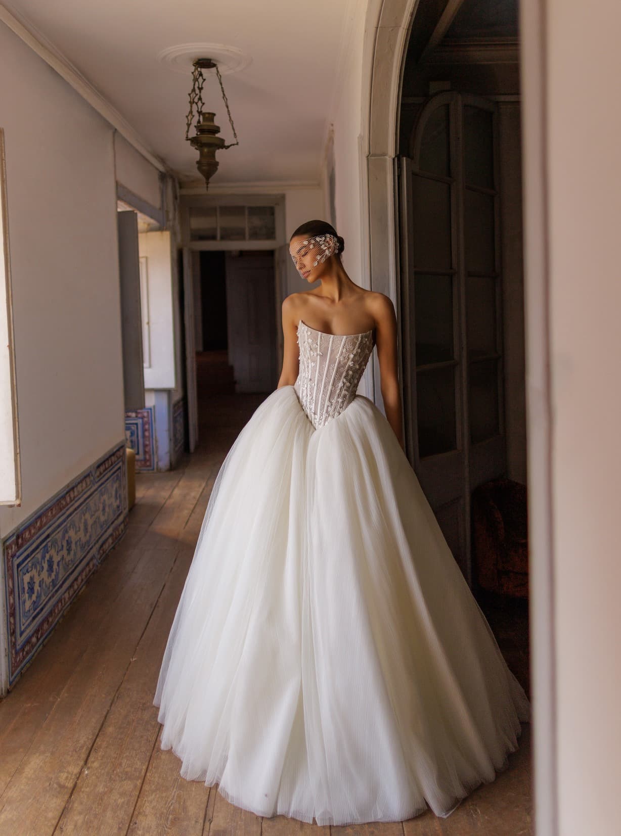 Elite - Wona wedding dress by Wona Swan-like ball gown with fitted corset top adorned by lightw... view 1