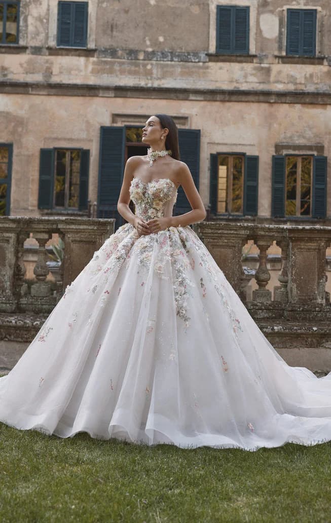 Front view of Veni Infantino Aurora wedding dress with strapless floral bodice and full tulle ballgown skirt