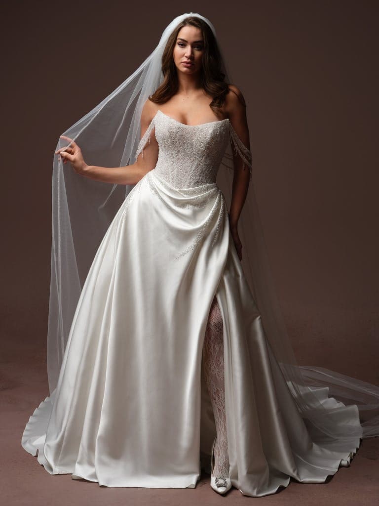 Rumi - Sottero and Midgley wedding dress by Sottero and Midgley - Lustrous beaded bodice cat eye neckline wedding gown
Uni...