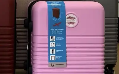How do I transport my wedding dress on a plane?